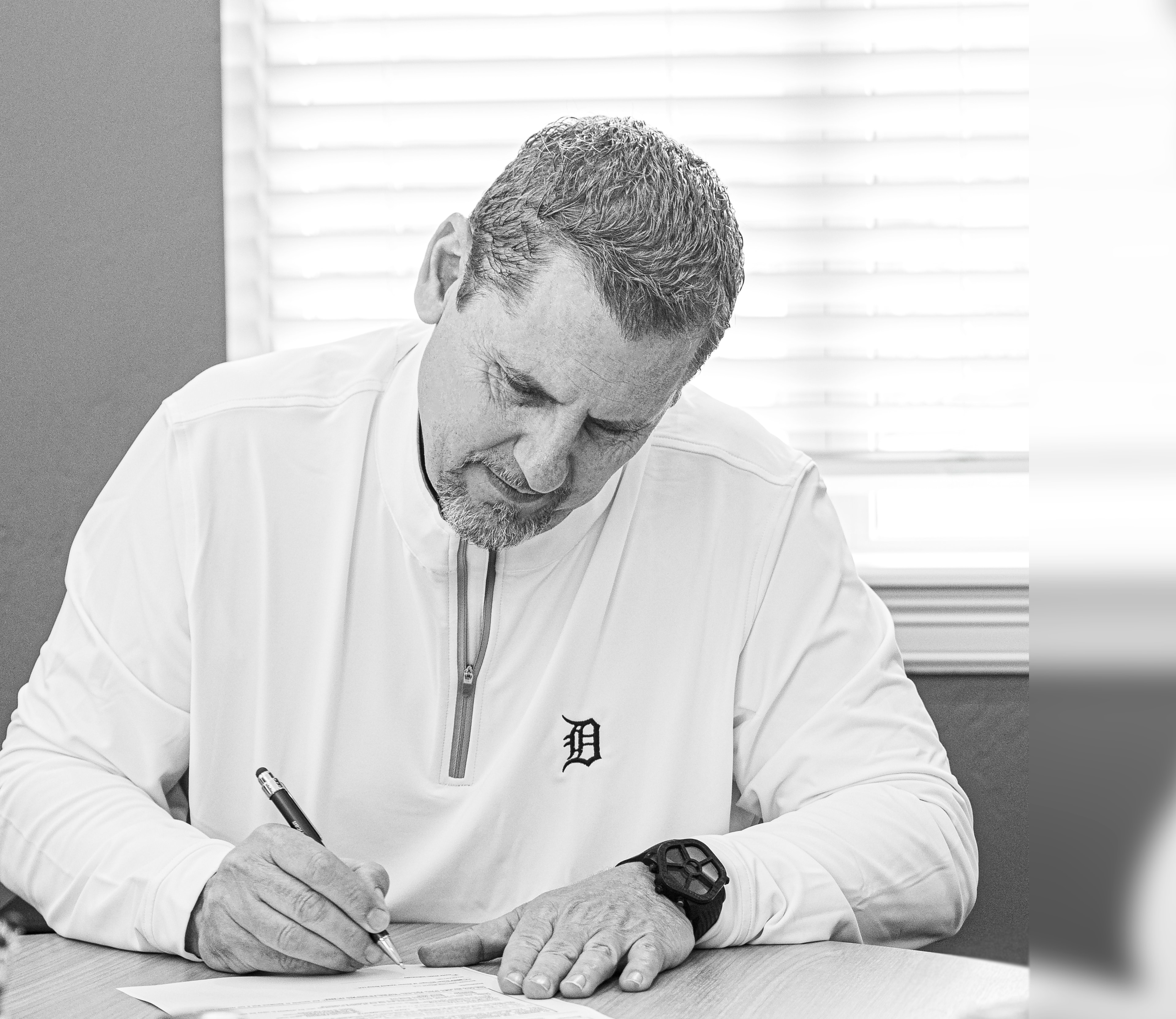 David Webb signing a document